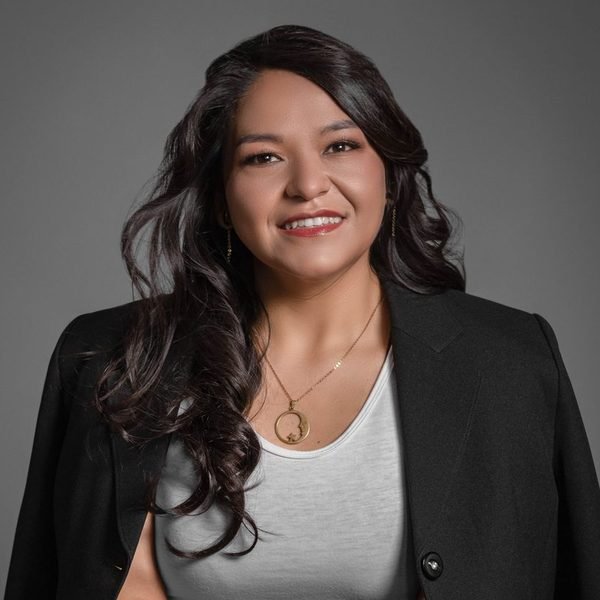 Portrait of a smiling businesswoman in a black blazer