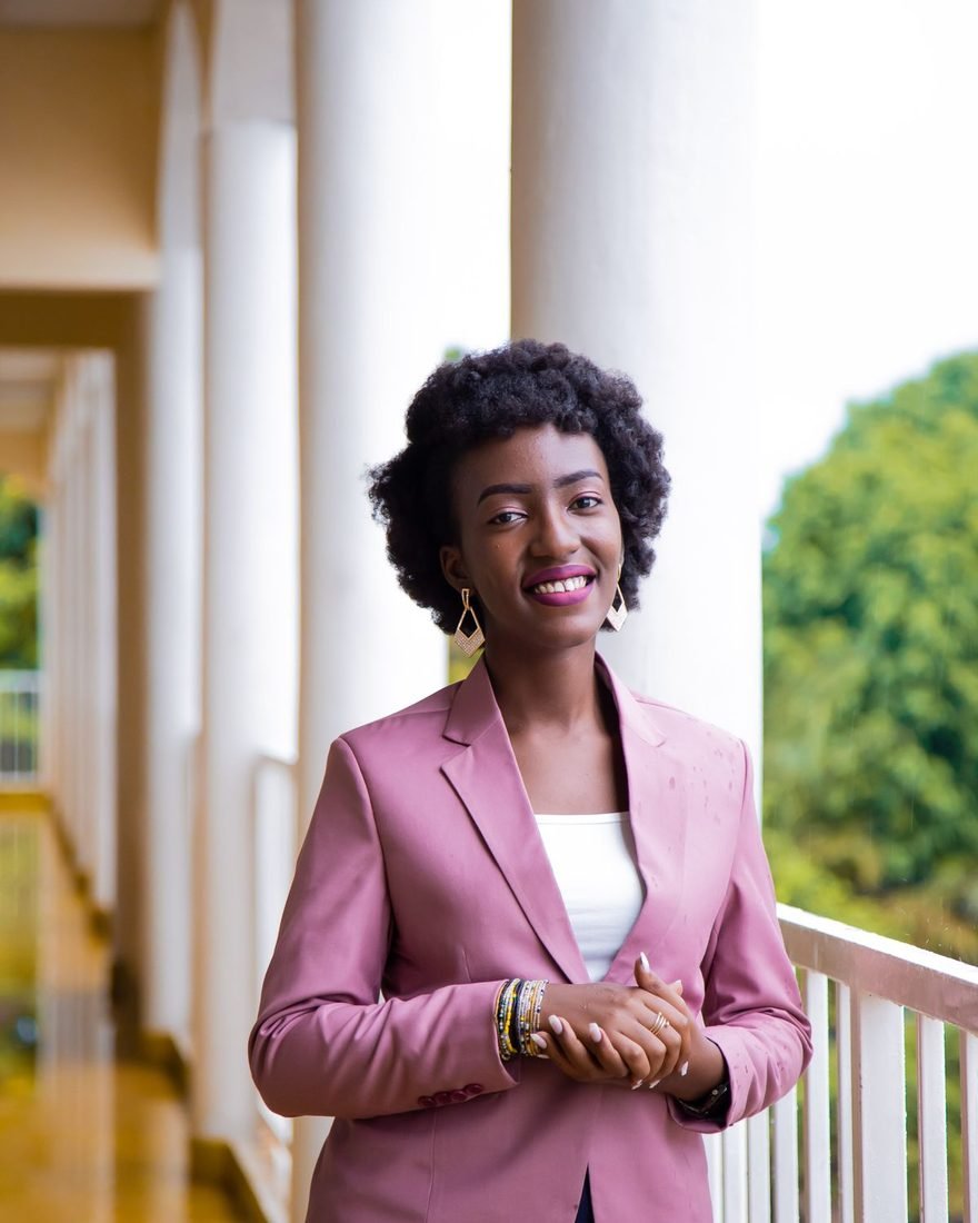 Portrait of a smiling woman in a pink blazer